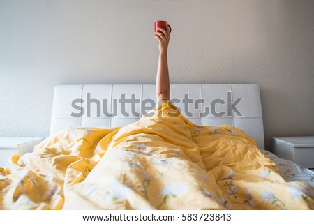 morning coffee in bed Royalty-Free Stock Photo #583723843