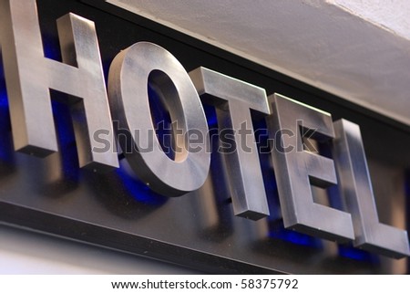 The hotel metallic inscription on the building