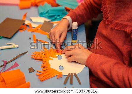 Teacher teach preschool kids in art class. Kids mask handmade. Kids study art entertainment.