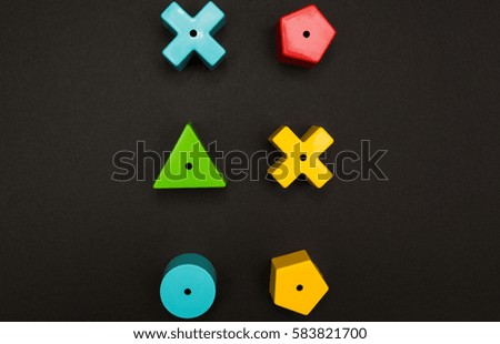 Multicolored toy figures on a black background