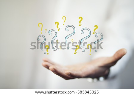 young business man hand question marks on white background