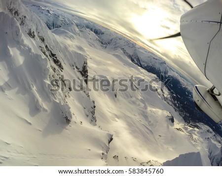 Flying over the beautiful mountains of British Columbia, Canada. Picture taken north of Vancouver, BC.