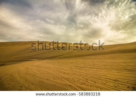 Buggy in the great sand dunes of the desert, in the rage of Huacachina - Ica - Peru
