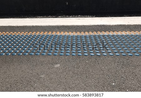 Dot material on train platforms support for people with disability