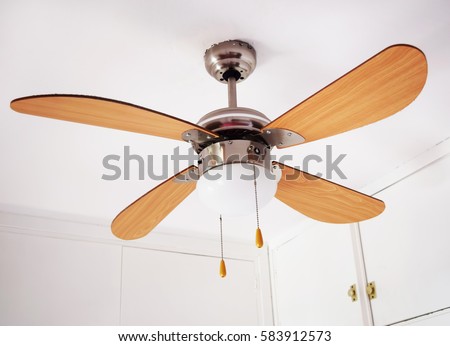 Electric ceiling lamp with propeller, electric installation services Royalty-Free Stock Photo #583912573