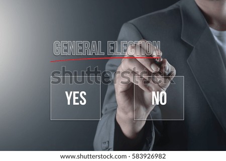 Hand of business man write or writing GENERAL ELECTION