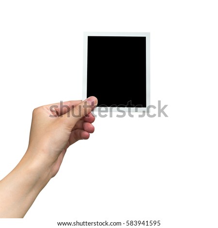 hand holding photo frame on isolated white with clipping path. Royalty-Free Stock Photo #583941595