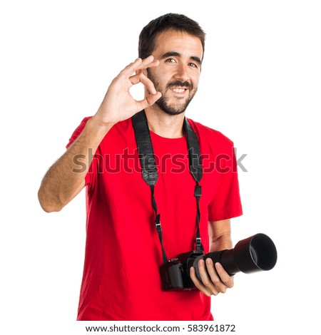 Photographer man making OK sign
