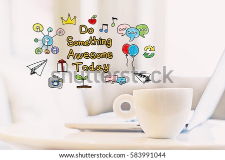 Do Something Awesome Today concept with a cup of coffee and a laptop