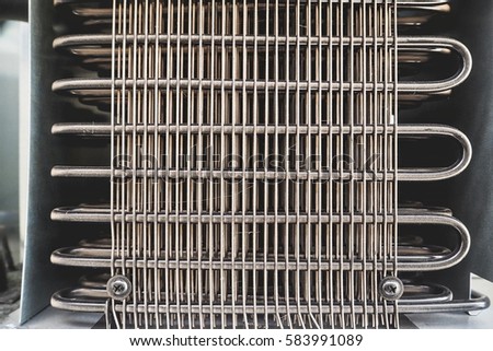 Texture of Refrigerator Condenser Coils Royalty-Free Stock Photo #583991089