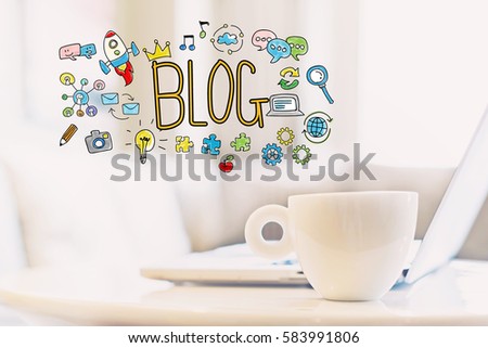 Blog concept with a cup of coffee and a laptop