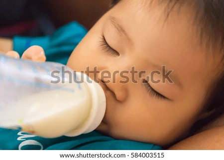 Soft focus Sleeping baby on bottle feeding.Close up.