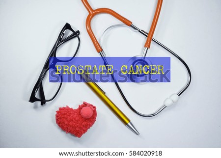 Stethoscope and heart shape on an open book with inscription PROSTATE CANCER on a white background. Medical, Healthcare and Wellness concept.