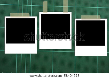 photo frame on green board background