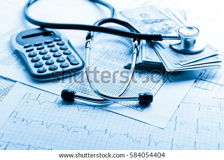 Health insurance application form with banknote and stethoscope concept for life planning. Blue toned 