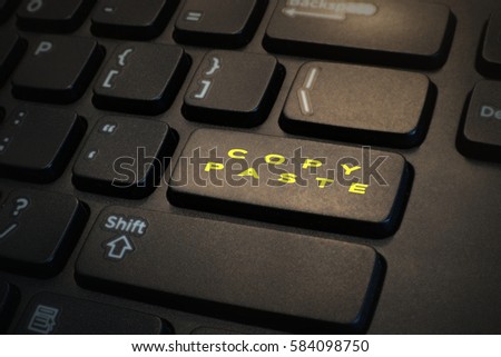 Keyboard button written " COPY PASTE " in yellow. Royalty-Free Stock Photo #584098750
