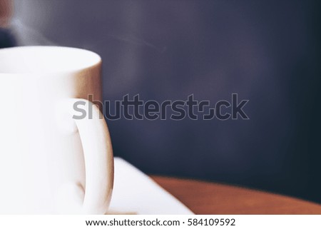 Hot coffee in ceramic cup on the table