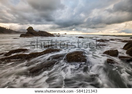 Beautiful landscape view of a stormy ocean coast with colorful sky. Picture taken at Shi Shi Beach,  Neah Bay, Washington, USA. Long Exposure and HDR Processed.