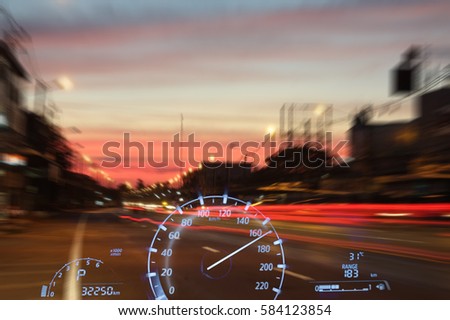 Dashboard speedometer double exposure blur street at night Royalty-Free Stock Photo #584123854