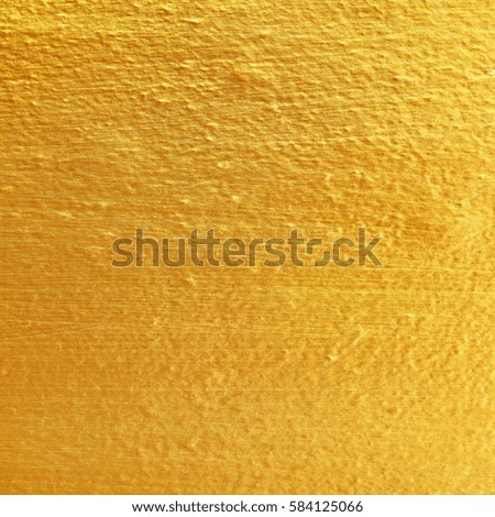 Gold paint on cement wall texture. golden texture for background