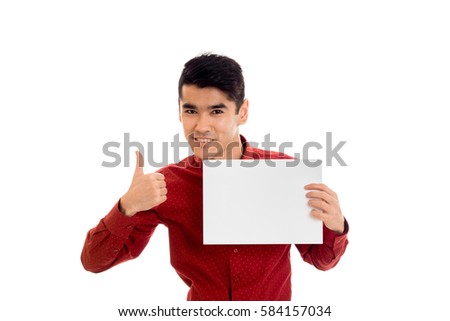a young guy in a red shirt holding a white paper isolated on white background