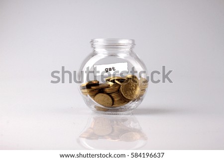 Savings concept: a glass jar with the word GST coin Malaysia