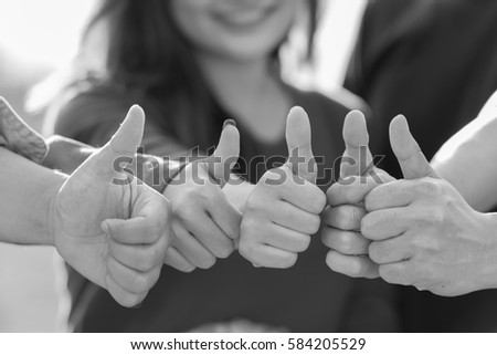 Good of young positive thinking people community join and combine giving hands with thumbs up  together expressing positivity, teamwork concepts. Royalty-Free Stock Photo #584205529