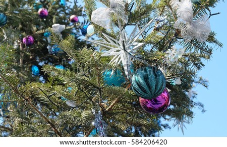 The decorated Christmas tree, blue ball.