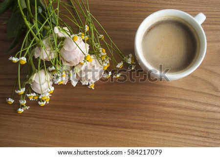 Chinese rose and daisy bouquet with a coffee