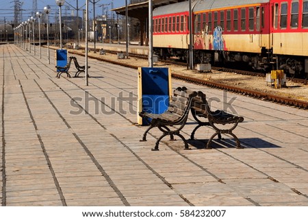 Railway. Train and benches. Waiting.