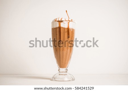 Chocolate smoothie with bananas on the dark wooden background