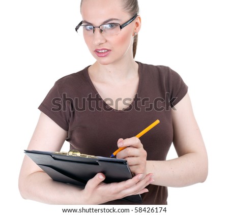 young woman with black glasses writing on clipboard