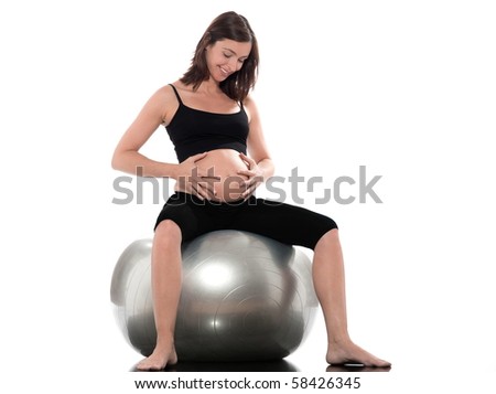 pregnant caucasian woman sitting on swiss ball isolated studio on white background