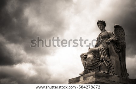 The statue of Nike, the goddess of victory (in Greek mythology) with sky background in monotone