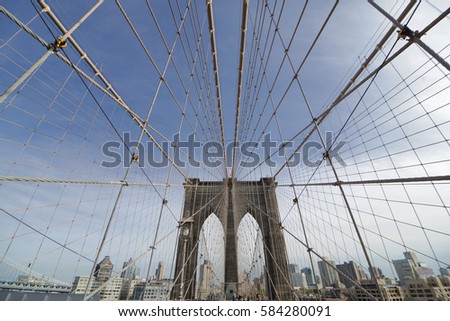 Perfectly geometric view of Brooklyn Bridge in NYC with overview on Manhattan skyline