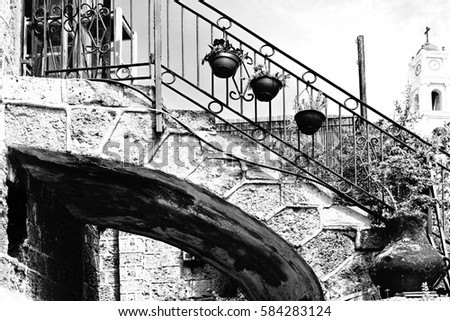 Area of old restored Jaffa in Israel. Ancient stone porch in Arabic style in Old Jaffa, Tel Aviv. Black and white picture