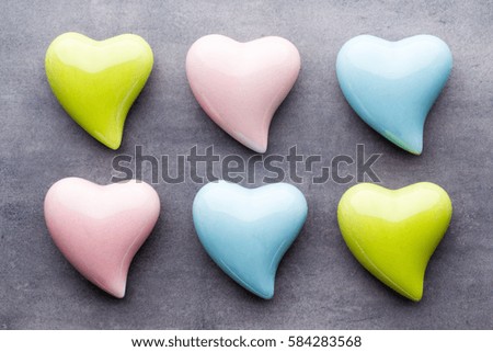 Valentines day greeting card. Colored heart on the gray background.