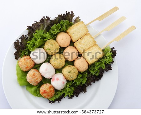 fish ball stick,steamboat, is a Chinese cooking method, prepared with a simmering pot of soup stock at the dining table, containing a variety of East Asian foodstuffs and ingredients. 