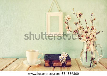 image of spring white cherry blossoms tree on wooden table