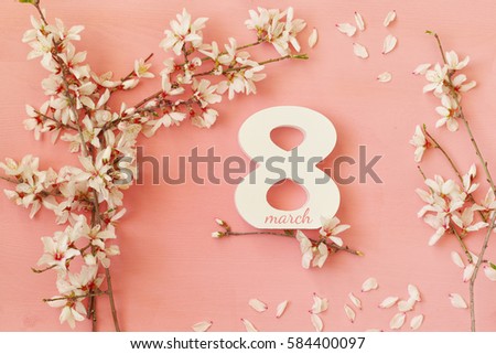 International women day concept. Cherry tree and date. Top view image