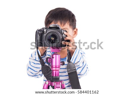 cute little boy taking camera,focus camera
