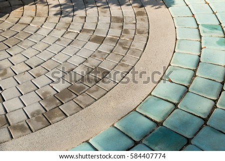 Pattern of cement brick floor in the public park.