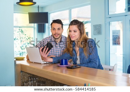 Couple enjoy in caffe restaurant.Colored photo