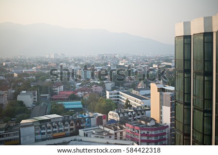 view of building in downtown form high building with mountain background in Chiang Mai, Thailand, City scape