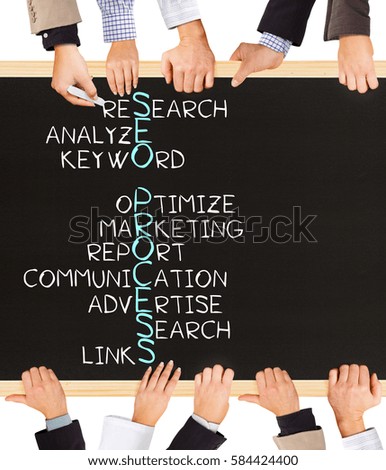 Photo of business hands holding blackboard and writing SEO PROCESS concept
