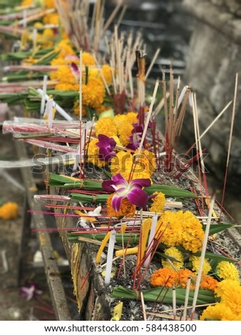 Flowers, incense, candles used in religious worship in Thailand