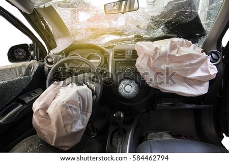 Car of accident make front windshield cracked and airbag explosion damaged at claim the insurance company. Working car repair  inspection at damaged of accident.   image blur focus  style. Royalty-Free Stock Photo #584462794