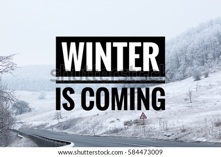Winter is coming text with snowy land in the background. Winter concept