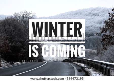 Winter is coming text with snowy land in the background. Winter concept