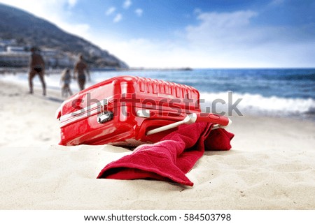 red suitcase and summer time 